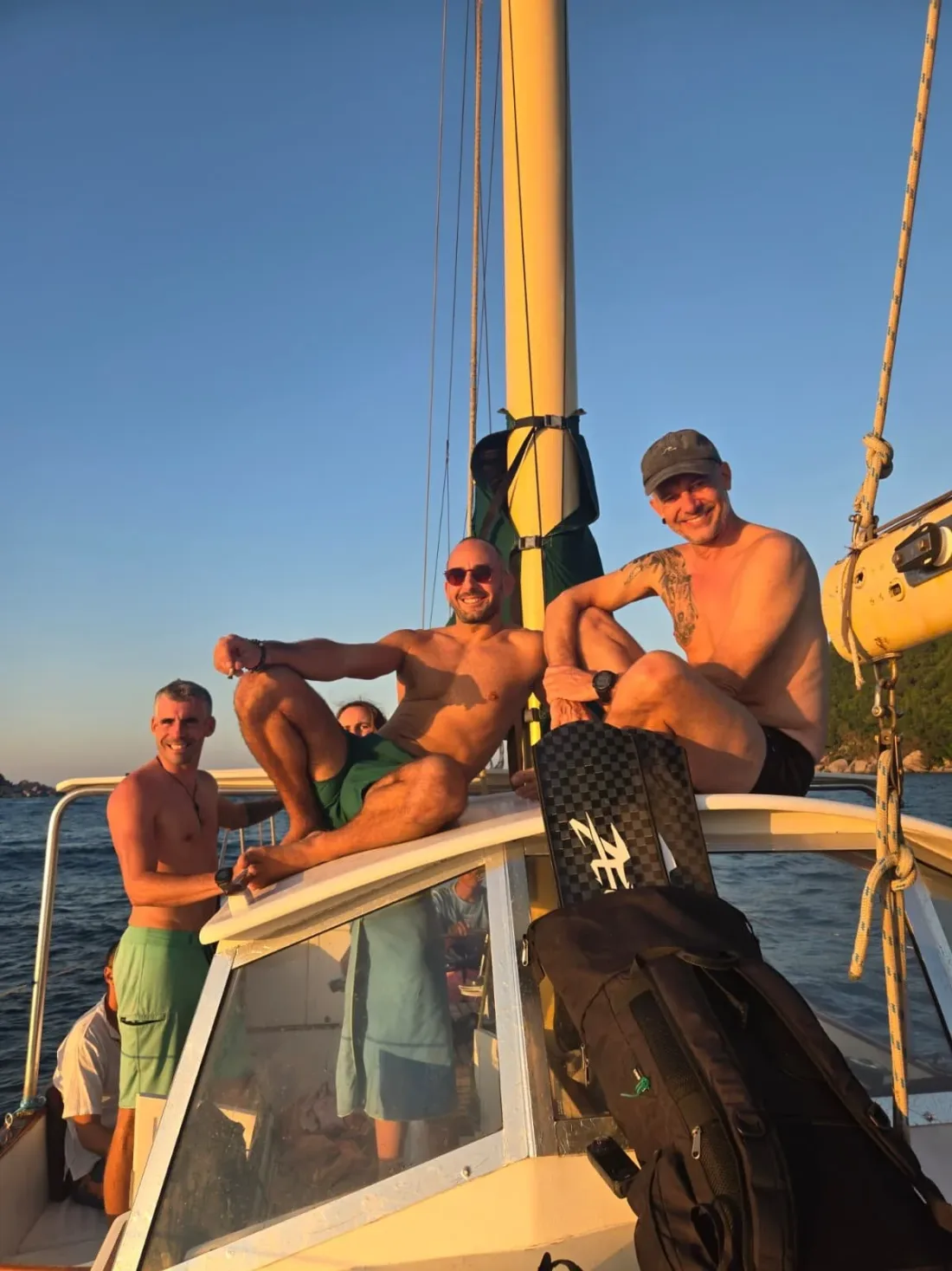Guests together on deck at sunset aboard SV Freedom Fargo